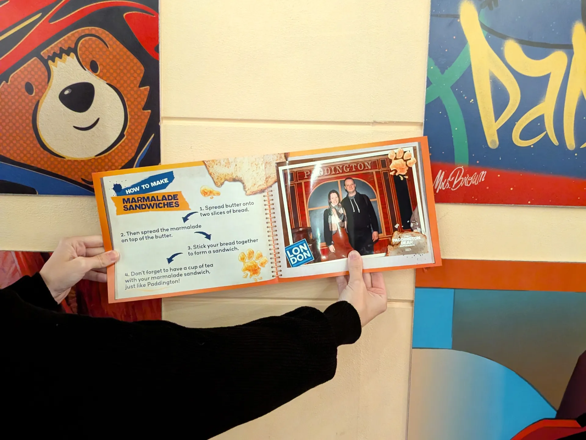 Gina showing a photo from the photo spot