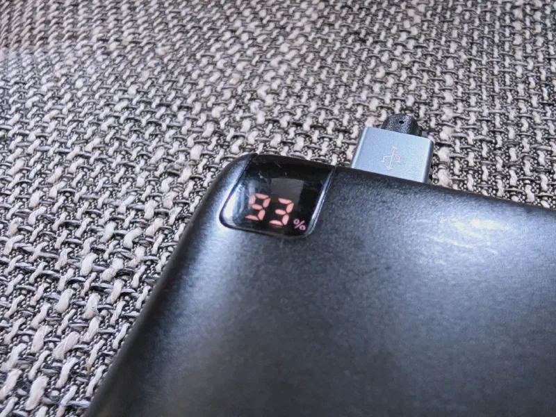 Close-up of the power bank's LED status display showing the exact charge level.