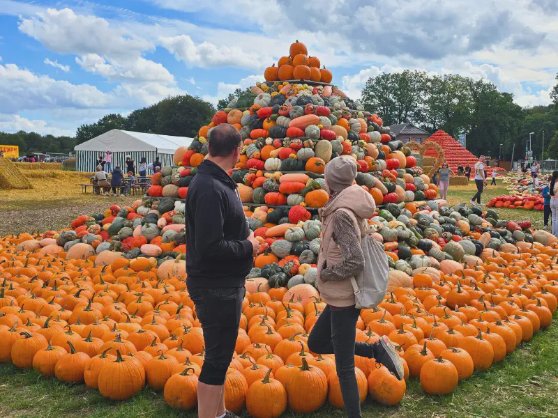 Oli and Gina in front of the pumpkin pyramid