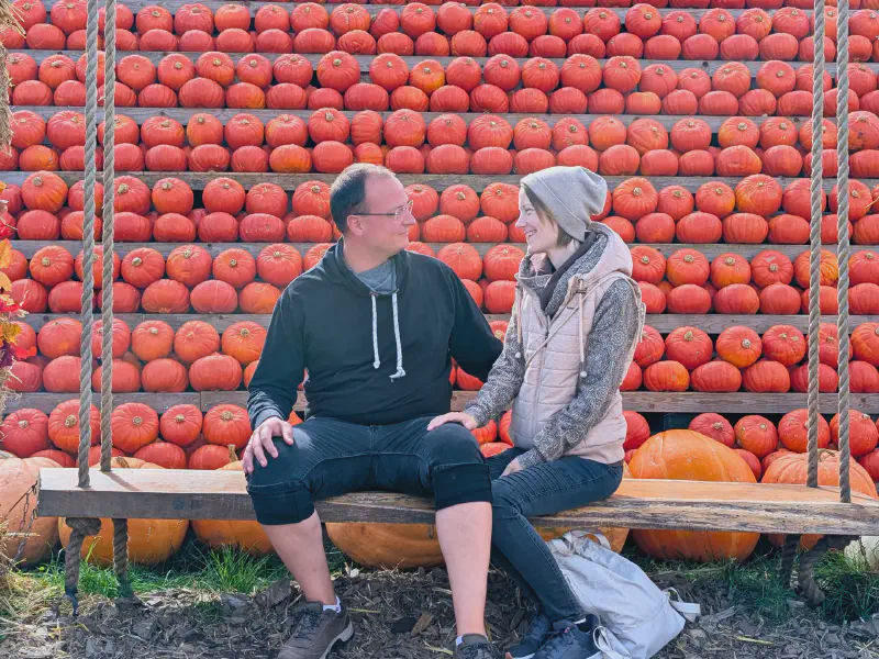 Oli and Gina on the pumpkin swing