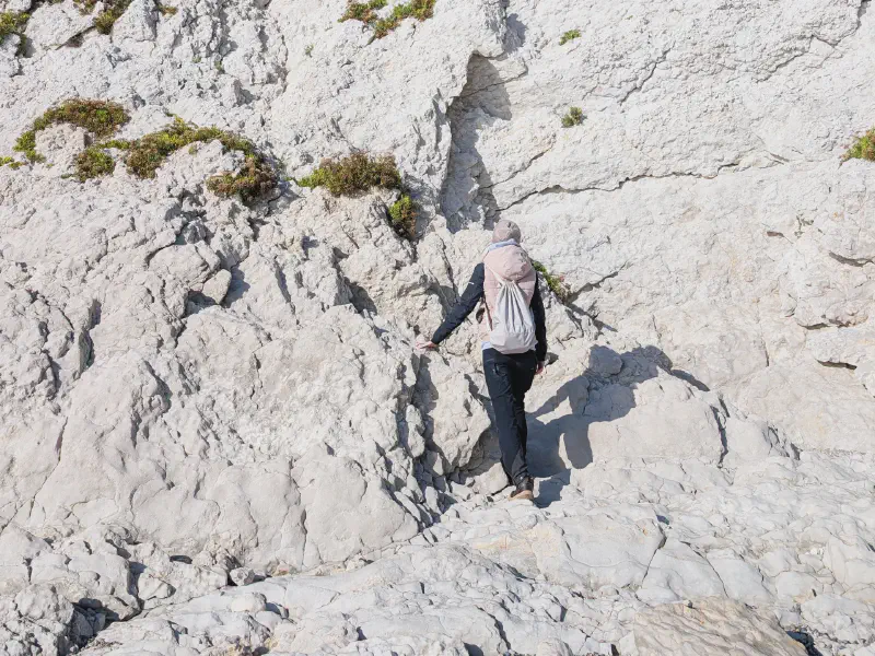 Gina climbing the rocks