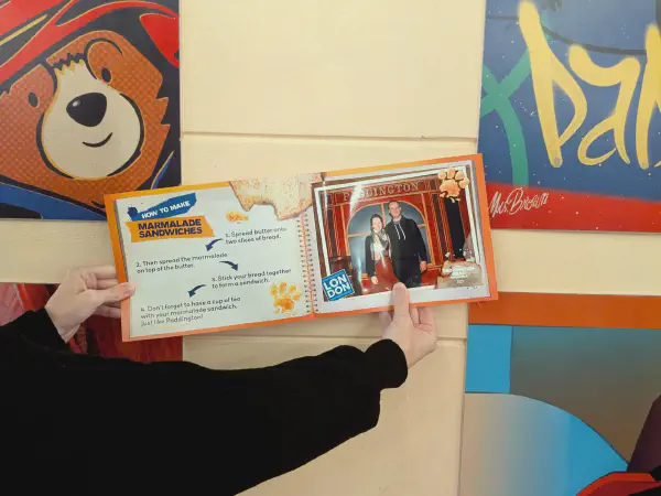 Gina showing a photo from the photo spot